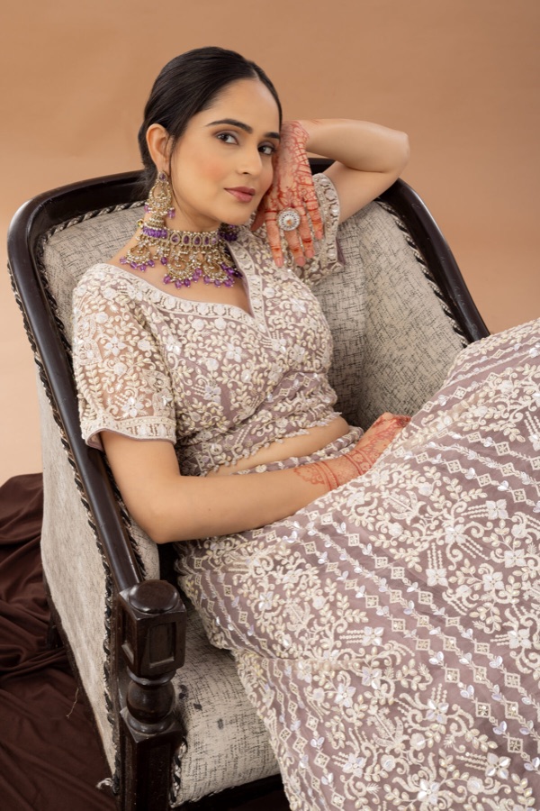Cream lace lehenga, reclined pose