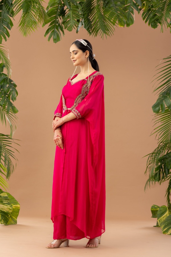 Hot pink cape dress over a slip gown