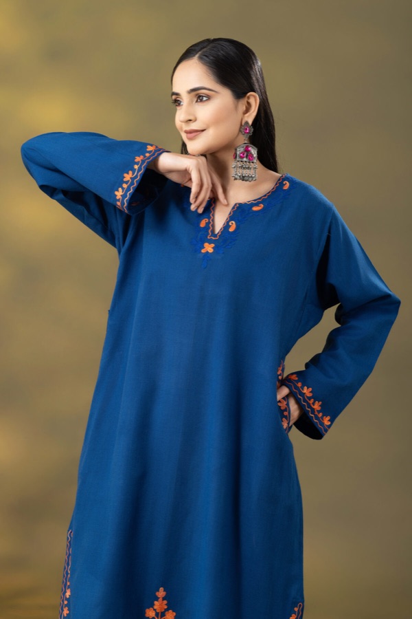 Blue embroidered kurta, candid pose